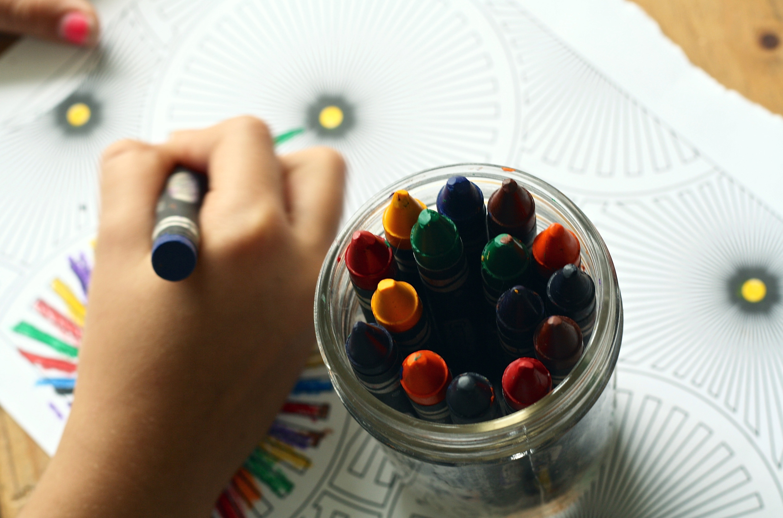 Child drawing with crayons - Harton Village Kindergarten Kids Club